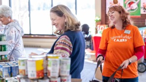 Volunteers organizing donated grocery items