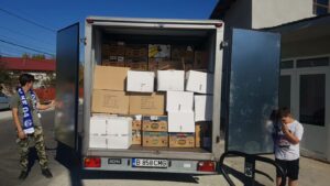 photo: truck in Romania with boxes of needed supplies for Ukrainian refugees